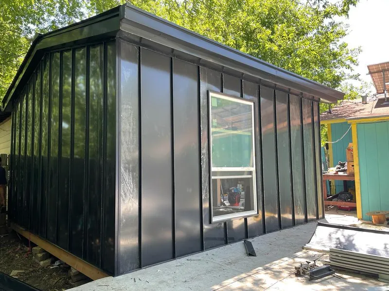 Black standing seam metal wall panels for Roof Inspection in Avondale